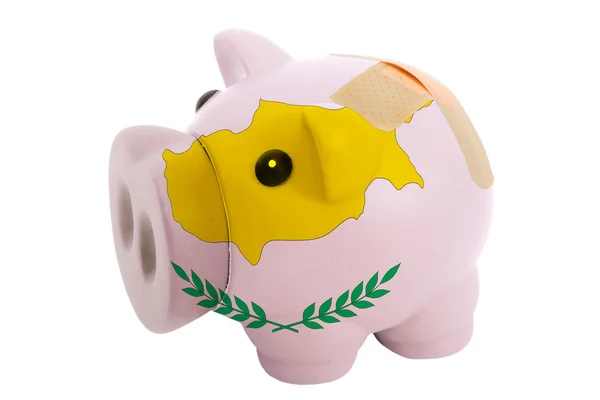 Closed piggy rich bank with bandage in colors national flag of c — Stock Photo, Image