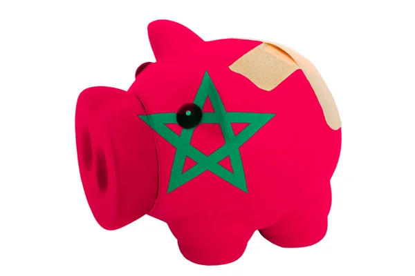 Closed piggy rich bank with bandage in colors national flag of m — Stock Photo, Image