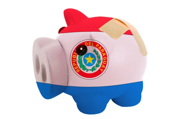 Closed piggy rich bank with bandage in colors national flag of p — Stock Photo, Image