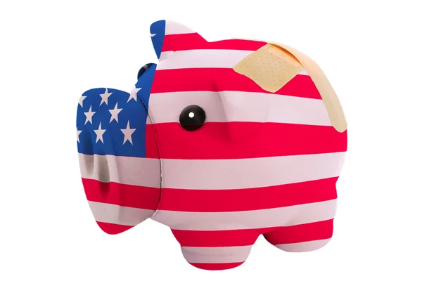 Closed piggy rich bank with bandage in colors national flag of a — Stock Photo, Image