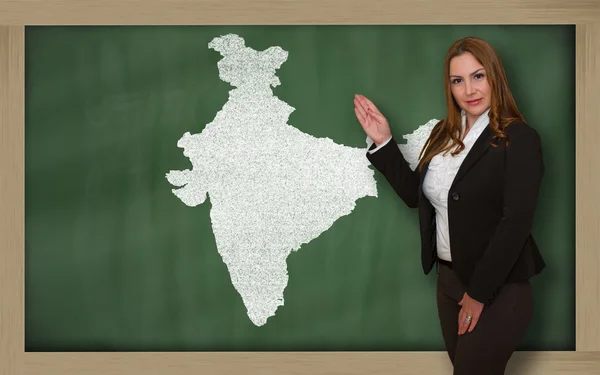 Teacher showing map of india on blackboard — Stock Photo, Image