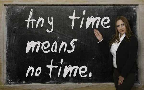 Teacher showing Any time means no time on blackboard — Stock Photo, Image