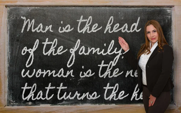 Teacher showing Man is the head of the family on blackboard — Stock Photo, Image