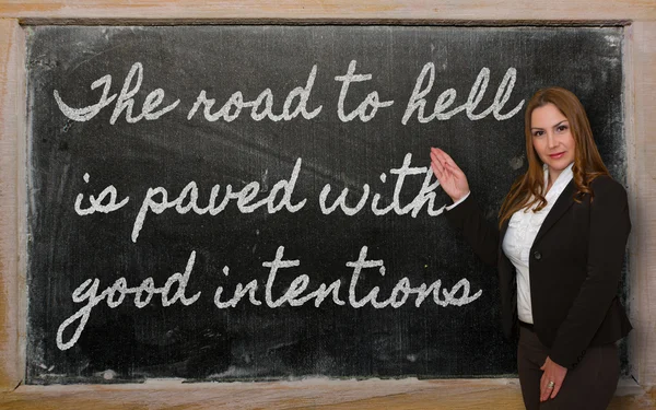 Teacher showing The road to hell is paved with good intentions o — Stock Photo, Image