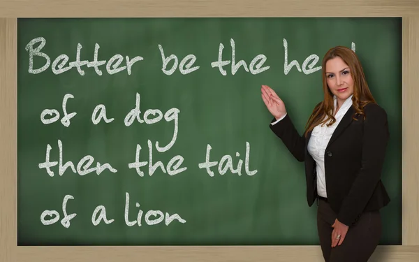 Teacher showing Better be the head of a dog then the tail of a l — Stock Photo, Image