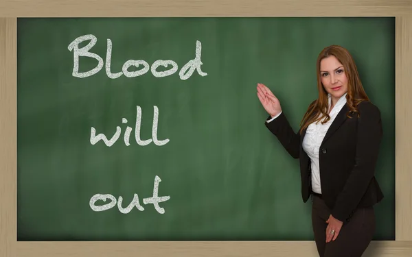 Enseignant montrant le sang va sortir sur le tableau noir — Photo