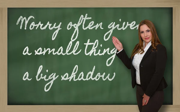 Teacher showing Worry often gives a small thing a big shadow on — Stock Photo, Image