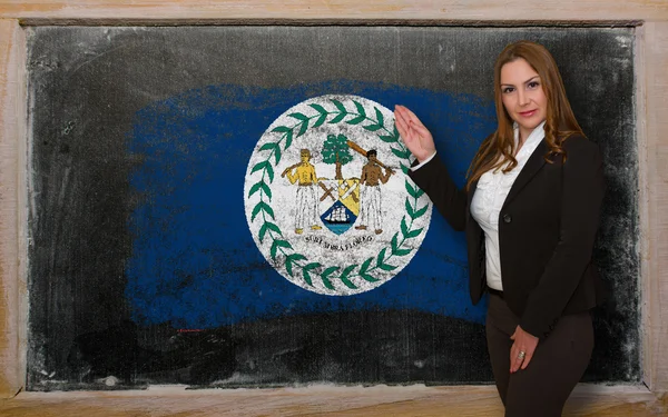 Teacher showing flag ofBelize on blackboard for presentation mar — Stock Photo, Image