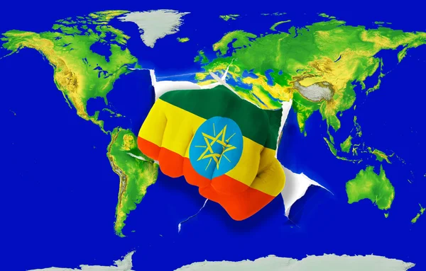 カラー世界地図パンチング エチオピアの国旗の拳します。 — ストック写真