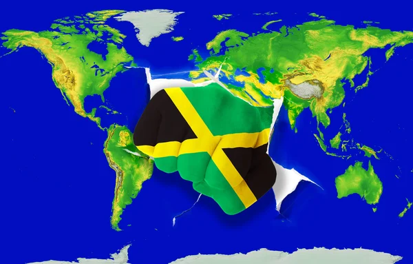 カラー世界地図パンチング ジャマイカの国旗の拳します。 — ストック写真