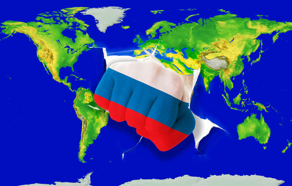 Fist in color national flag of russia punching world map