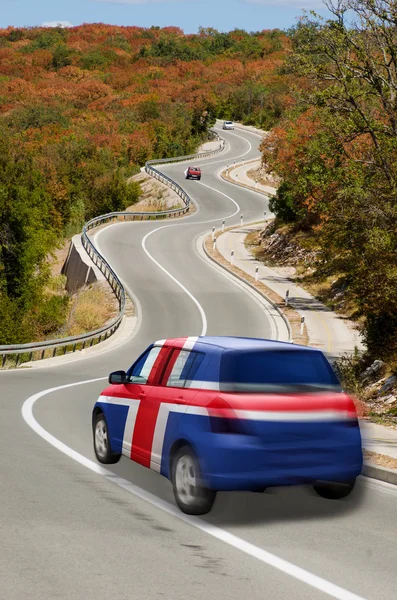 Car on road in national flag of iceland colors — Stock Photo, Image