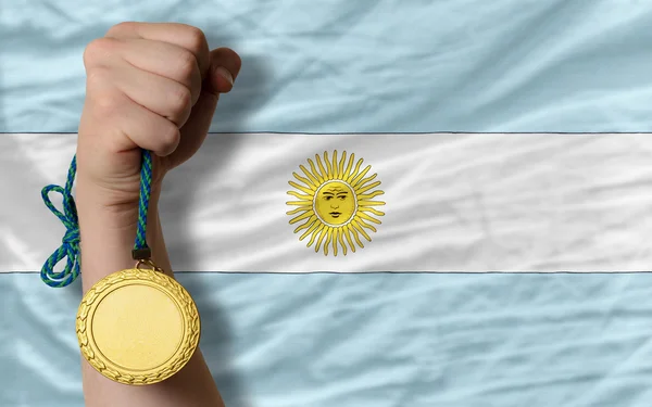 Guldmedalj för idrott samt nationella flagga i argentina — Stockfoto