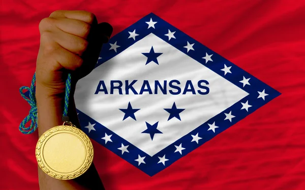 Medalha de ouro por esporte e bandeira do estado americano do arkansas — Fotografia de Stock