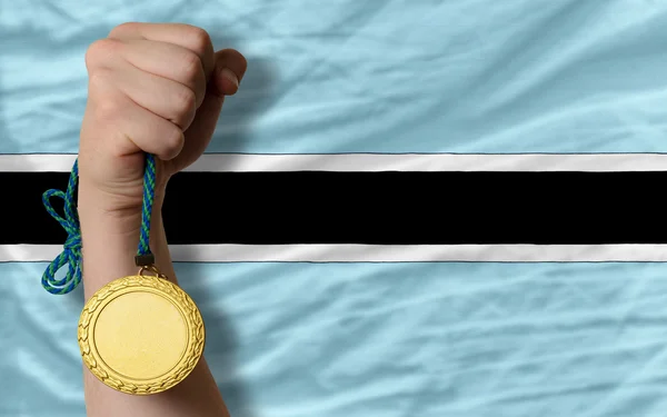 Médaille d'or pour le sport et drapeau national du Botswana — Photo