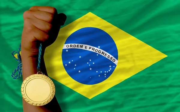 Gold medal for sport and national flag of brazil — Stock Photo, Image