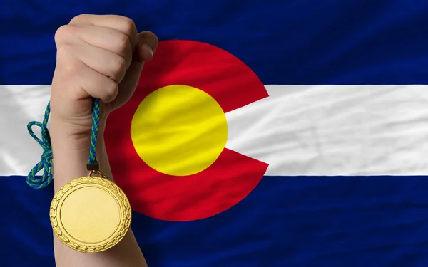 Gold medal for sport and flag of american state of colorado — Stock Photo, Image