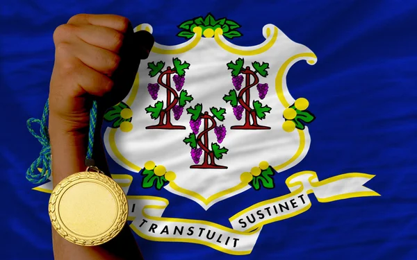 Gold medal for sport and flag of american state of connecticut — Stock Photo, Image