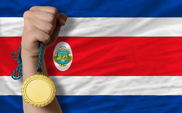 Guldmedalj för idrott samt nationella flagga costarica — Stockfoto