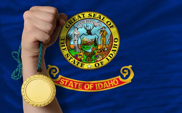 Medalha de ouro por esporte e bandeira do estado americano de idaho — Fotografia de Stock