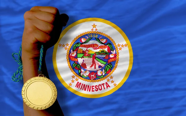 Gold medal for sport and flag of american state of minnesota — Stock Photo, Image
