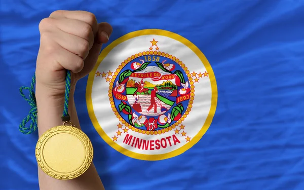 Gold medal for sport and flag of american state of minnesota — Stock Photo, Image