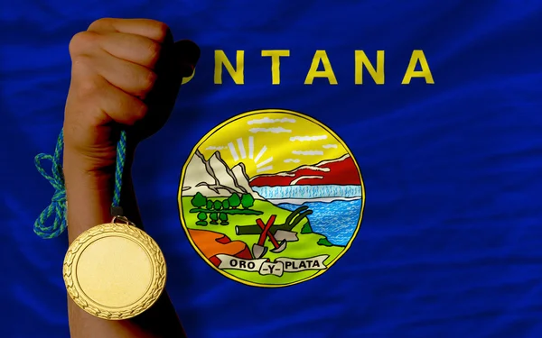 Zlatá medaile pro sport a vlajka amerického státu montana — Stock fotografie