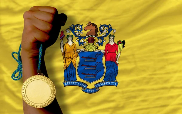 金牌为体育和旗子的美国新泽西州 — 图库照片