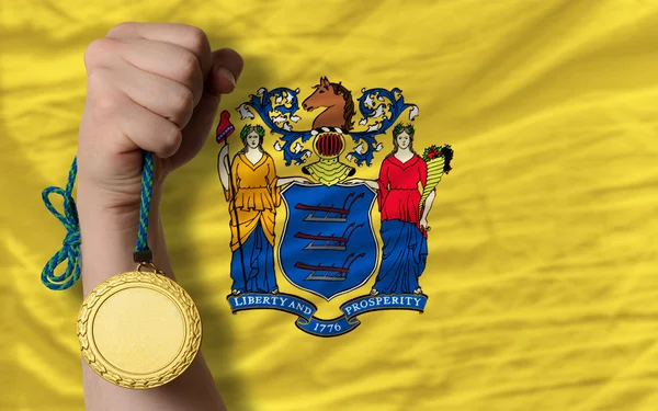 金牌为体育和旗子的美国新泽西州 — 图库照片
