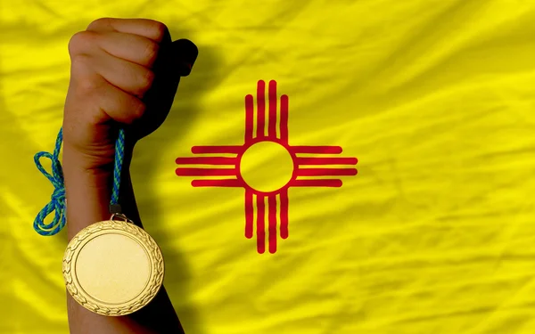 Gold medal for sport and flag of american state of new mexico — Stock Photo, Image