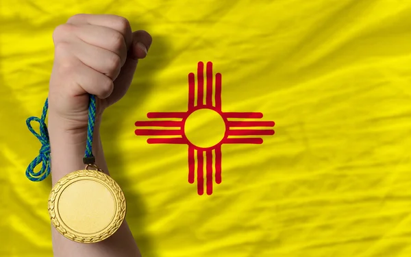 Gold medal for sport and flag of american state of new mexico — Stock Photo, Image