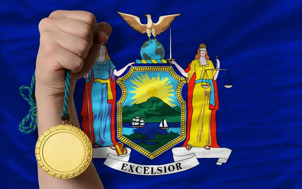 Gold medal for sport and flag of american state of new york — Stock Photo, Image