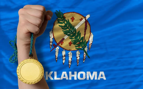 Gold medal for sport and flag of american state of oklahoma — Stock Photo, Image