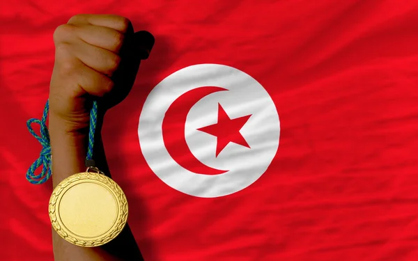 Medaglia d'oro allo sport e bandiera nazionale della tunisia — Foto Stock