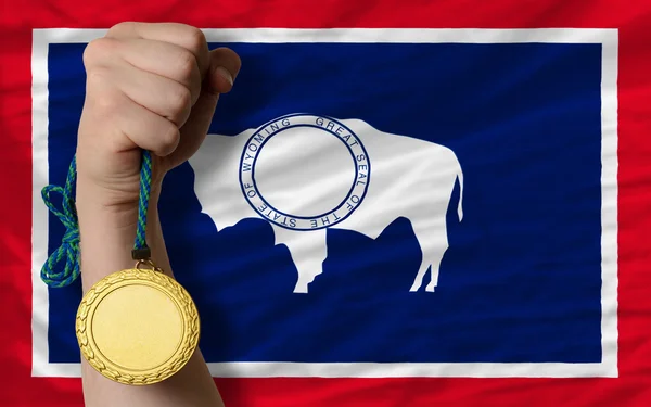Gold medal for sport and flag of american state of wyoming — Stock Photo, Image