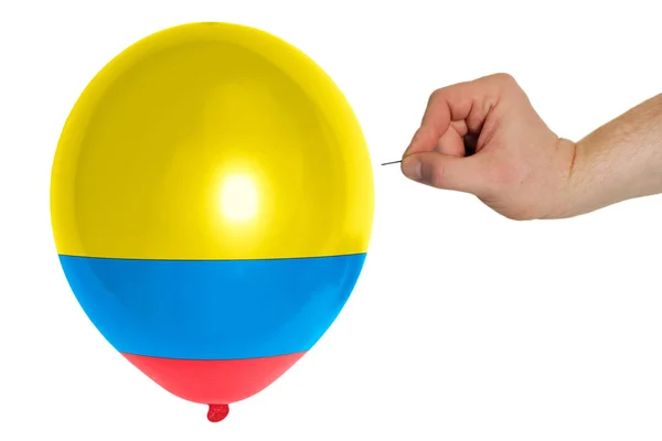 Bursting balloon colored in national flag of columbia — Stock Photo, Image