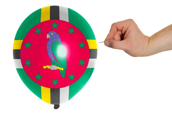 Bursting balloon colored in national flag of dominica — Stock Photo, Image