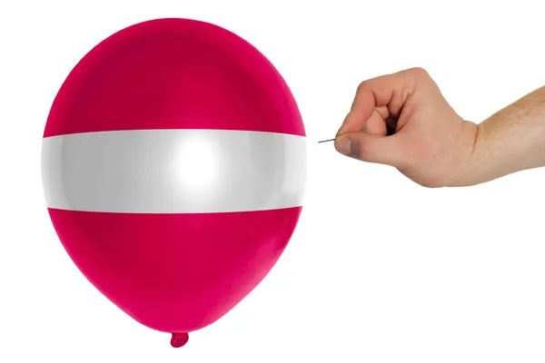 Bursting balloon colored in national flag of latvia — Stock Photo, Image
