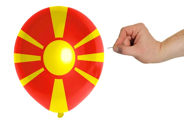 Bursting balloon colored in national flag of macedonia — Stock Photo, Image