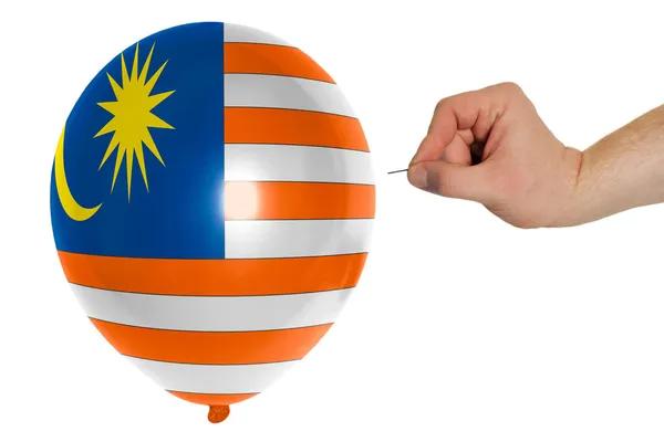 Взрыв воздушного шара, окрашенного в национальный флаг Малайзии — стоковое фото