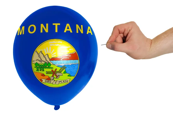 Bursting balloon colored in flag of american state of montana — Stock Photo, Image