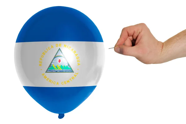 Bursting balloon colored in national flag of nicaragua — Stock Photo, Image