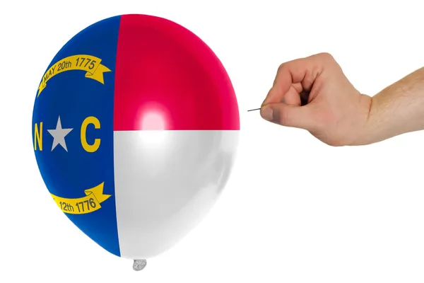 Bursting balloon colored in flag of american state of north car — Stock Photo, Image