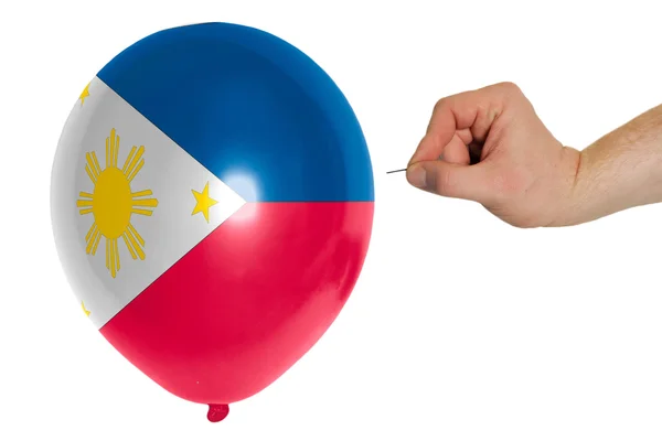 Balão estourando colorido na bandeira nacional de filipinas — Fotografia de Stock