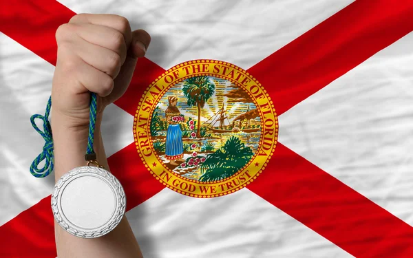 Серебряная медаль за спорт и флаг американского штата Флорида — стоковое фото