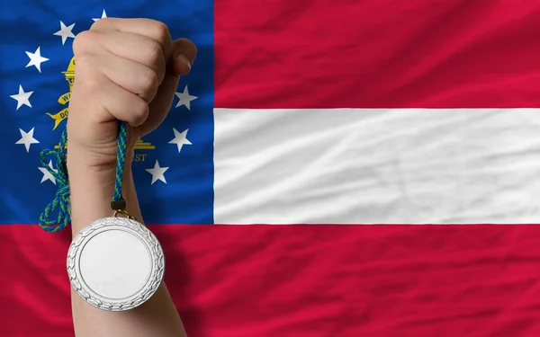 Silver medal for sport and flag of american state of georgia — Stock Photo, Image