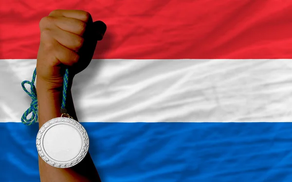 Silver medal for sport and national flag of holland — Stock Photo, Image