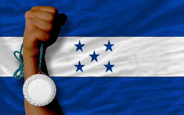 Médaille d'argent pour le sport et drapeau national des honduras — Photo