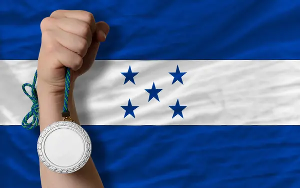 Silvermedalj för idrott samt nationella flagga i honduras — Stockfoto