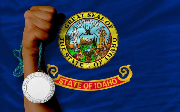 Silver medal for sport and flag of american state of idaho — Stock Photo, Image